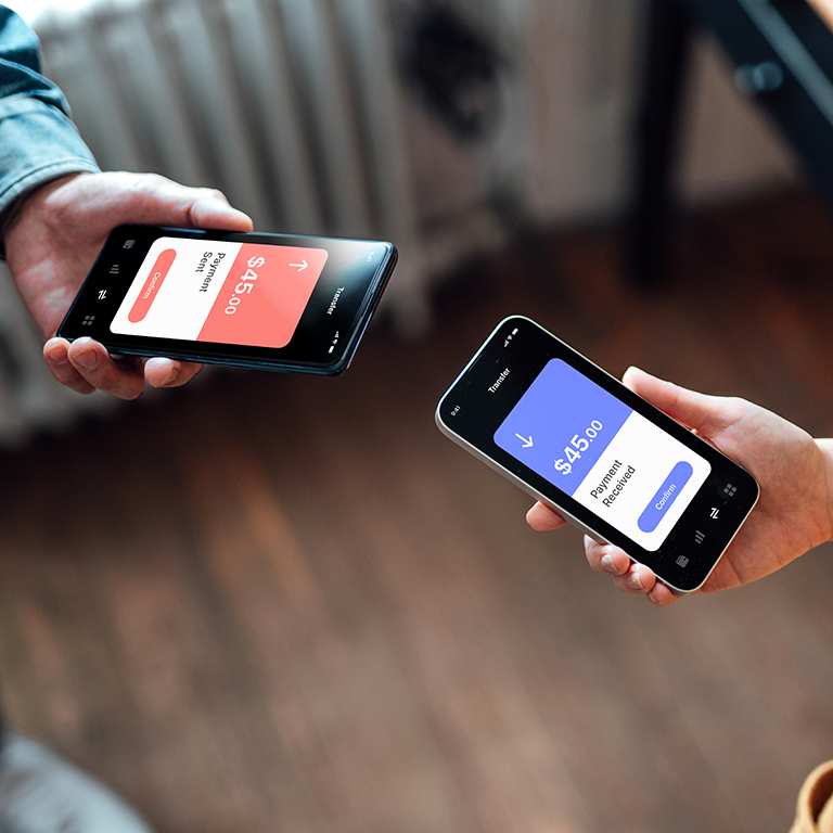 Two people holding smartphones, one showing a payment sent screen for $45.00 and the other showing a payment received screen for $45.00.